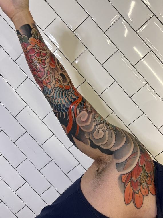 Carpa e ondas, tatuagem de Denis Vazios